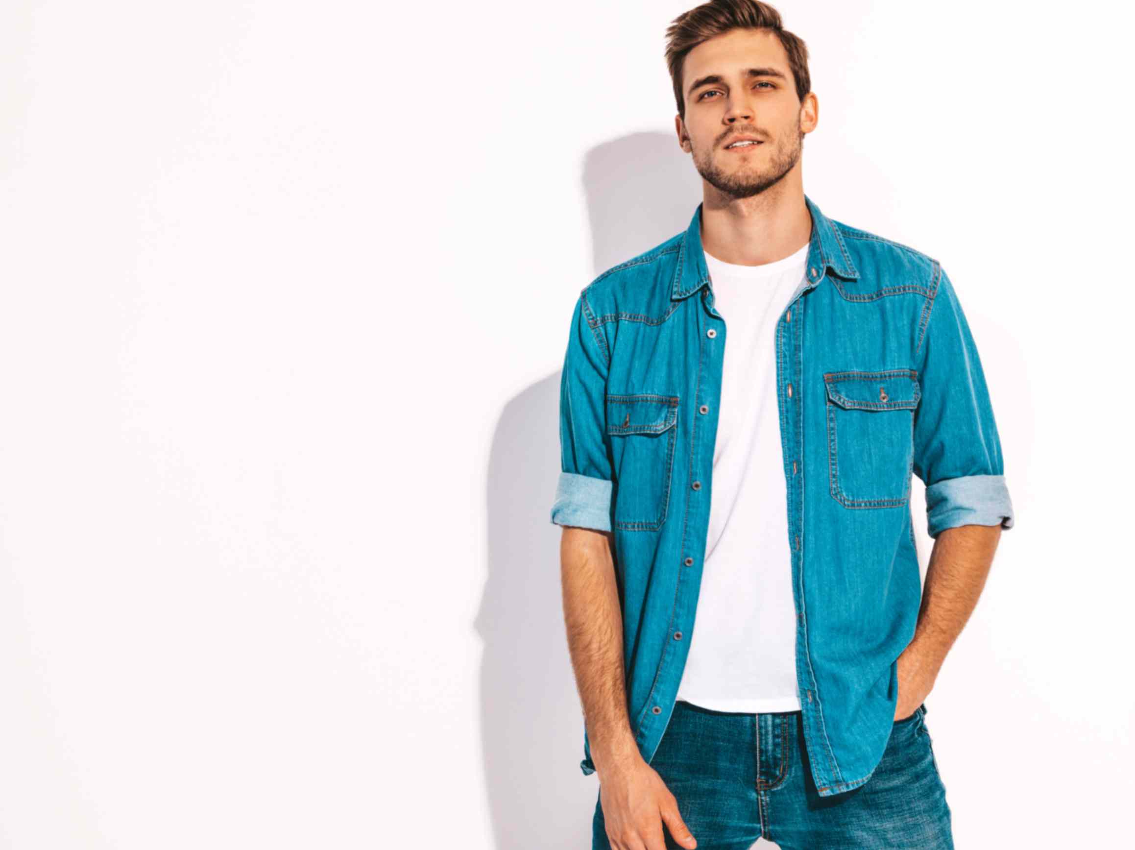Slim-fit blue jeans styled with a crisp white tee